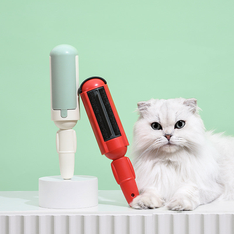 Hair remover rollers in white/green and red/black next to a cat