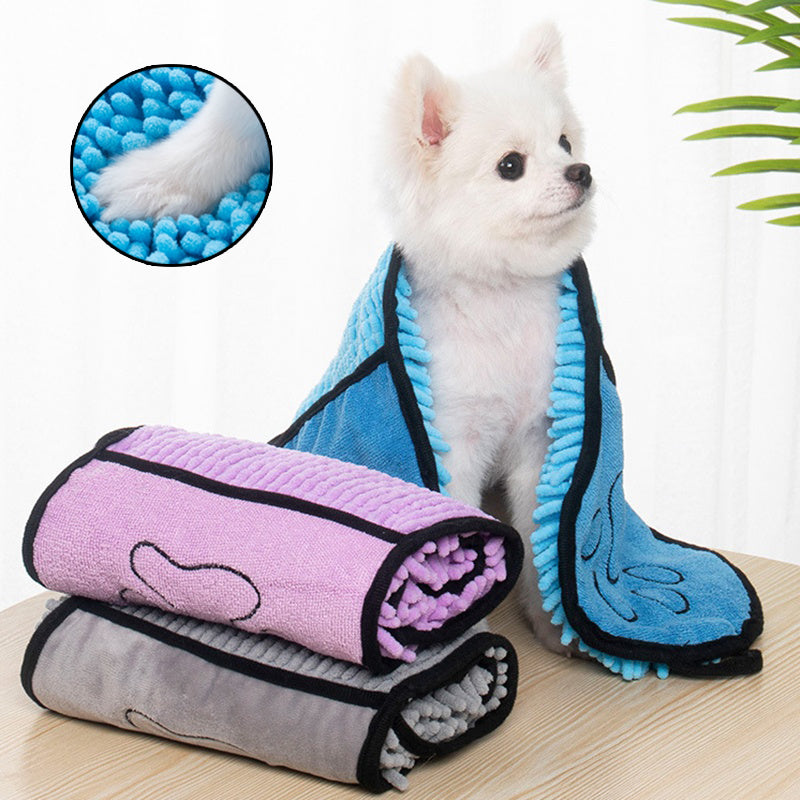 Small dog wrapped in a chenille towel